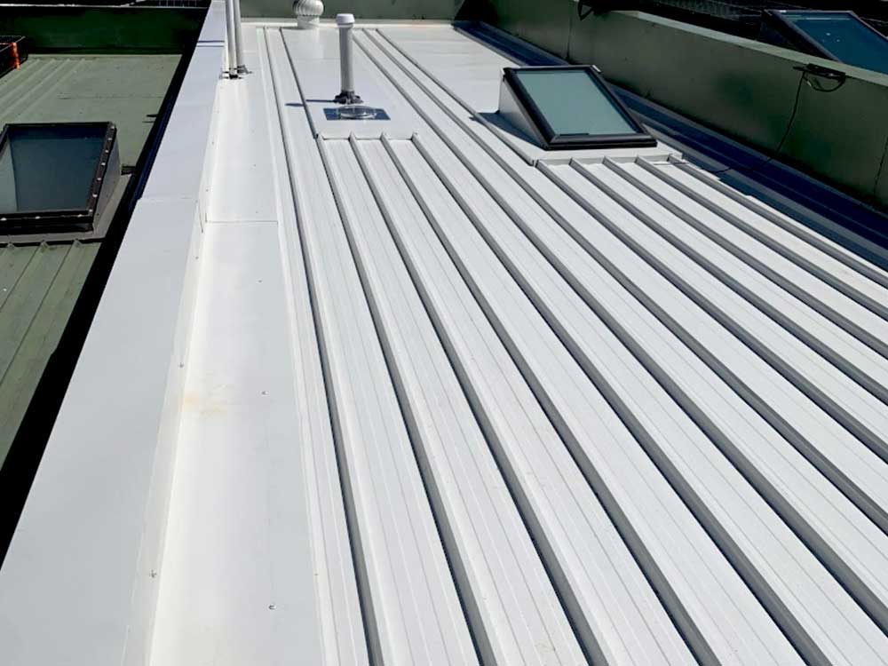 Freshly coated light coloured roof surface