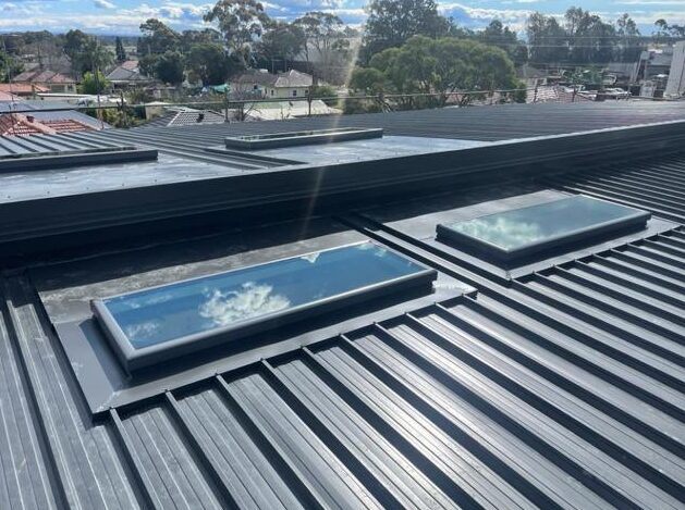 Metal roof with skylights during repair work